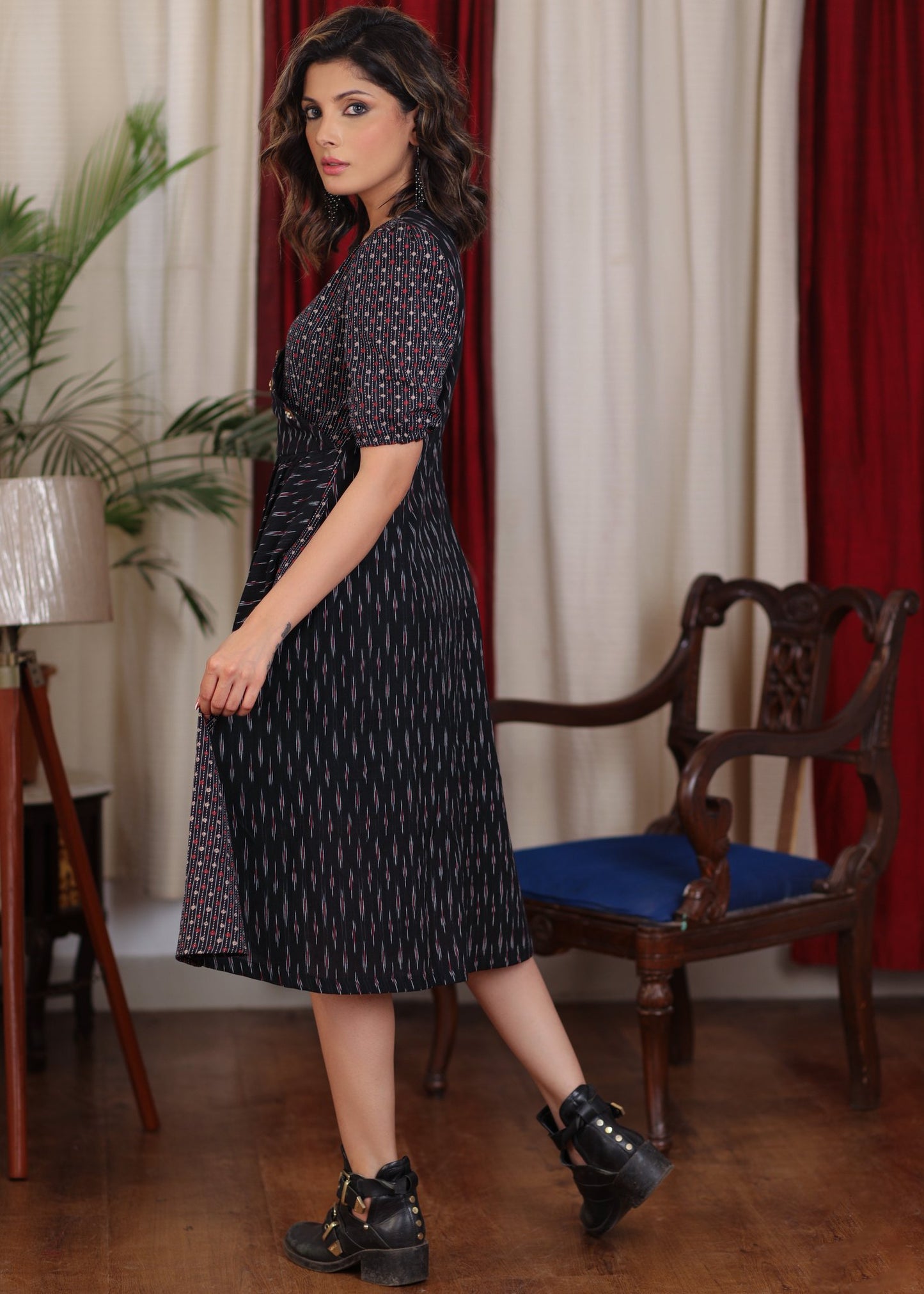 Elegant black ikat and katha work overlap dress highlighted with beautiful wooden buttons