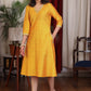 Beautiful mango cotton silk dress with pockets highlighted with zari lace and coin embellishments