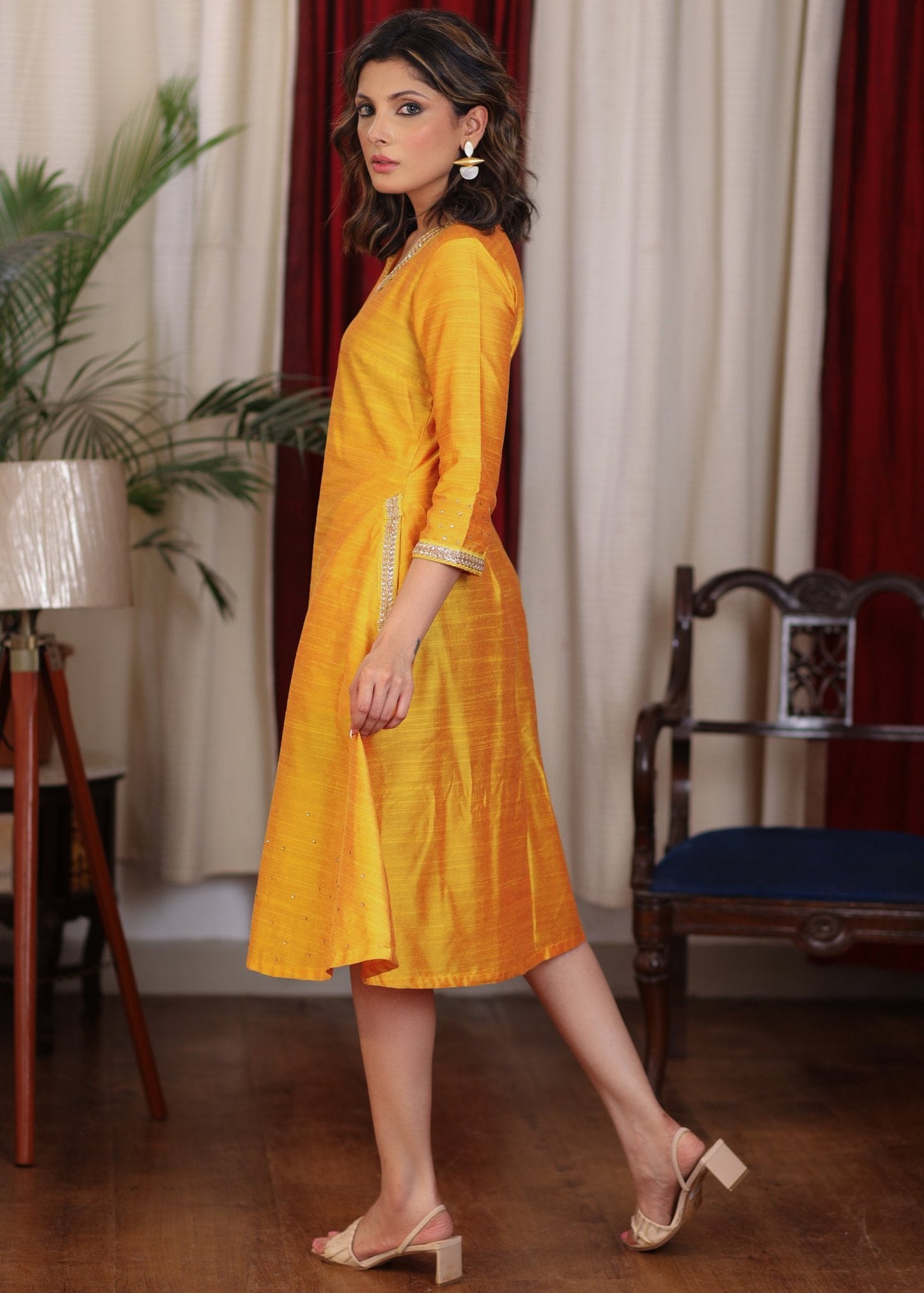 Beautiful mango cotton silk dress with pockets highlighted with zari lace and coin embellishments