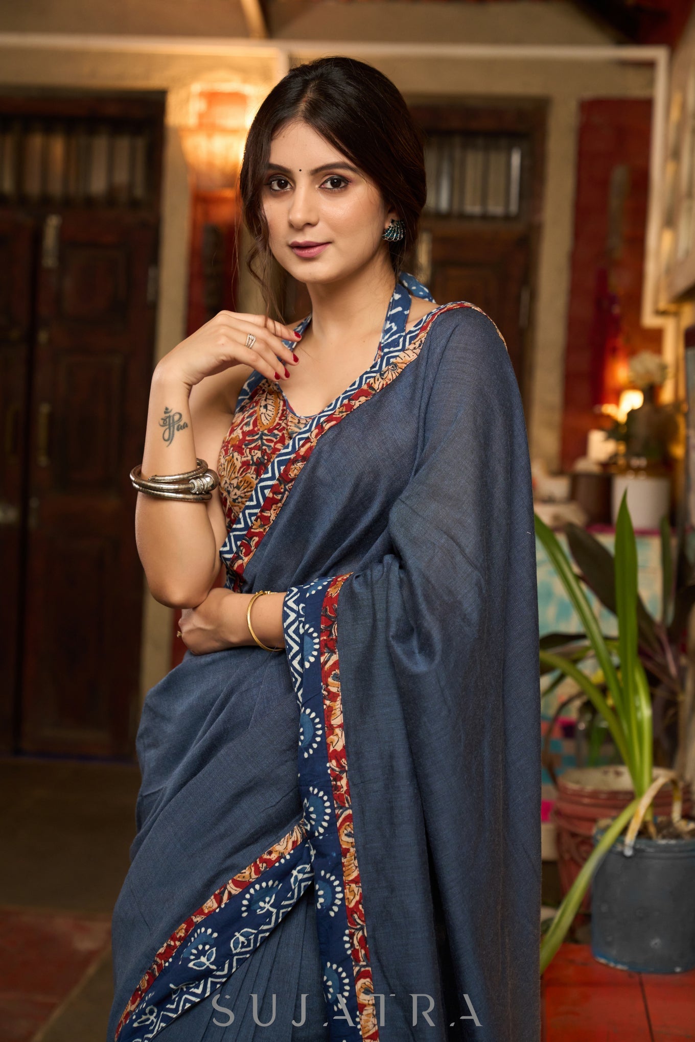 Stylish midnight blue cotton saree highlighted with indigo and kalamkari borders