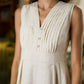 Elegant Off-White Cotton A line one piece dress highlighted with Pleated Yoke