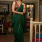 Trendy bottle green cotton saree highlighted with golden lace