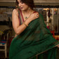 Trendy bottle green cotton saree highlighted with golden lace