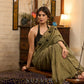 Elegant dark olive green cotton saree highlighted with floral applique and overall scallops