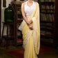 Gracious pastel yellow modal cotton saree highlighted with beautiful laces