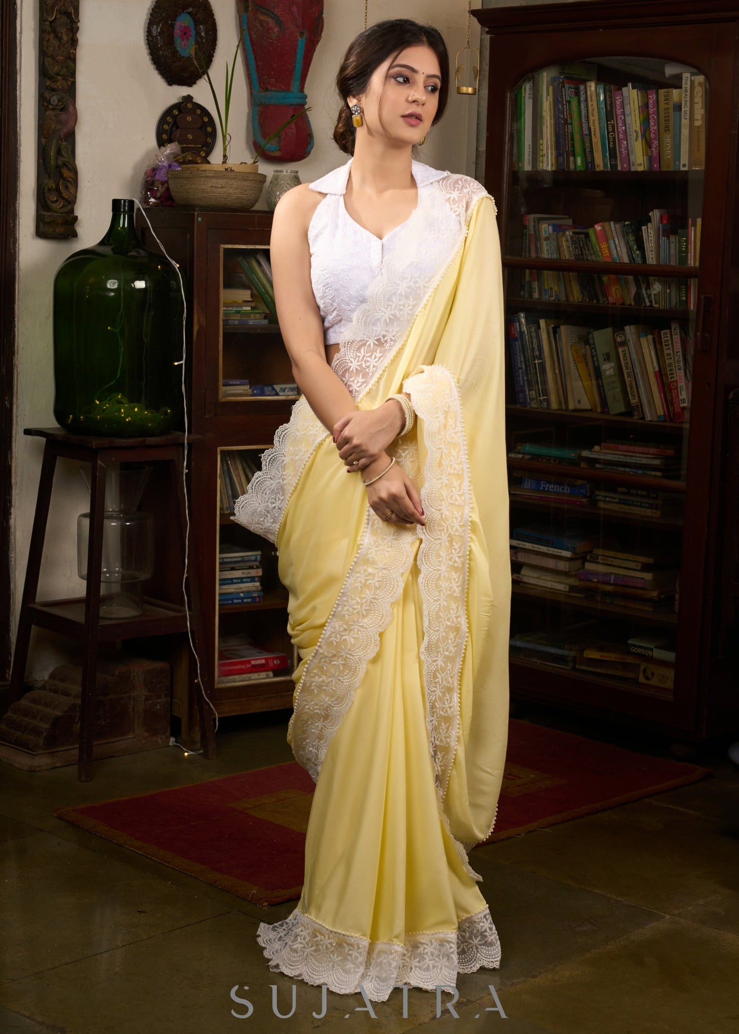 Gracious pastel yellow modal cotton saree highlighted with beautiful laces