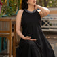 Elegant black cotton halter neck dress with embroidered neckline