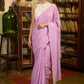 Gracious lilac mul cotton saree with embroidered disty florals and overall scallops