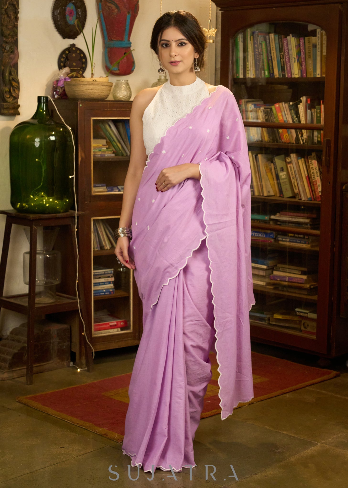 Gracious lilac mul cotton saree with embroidered disty florals and overall scallops