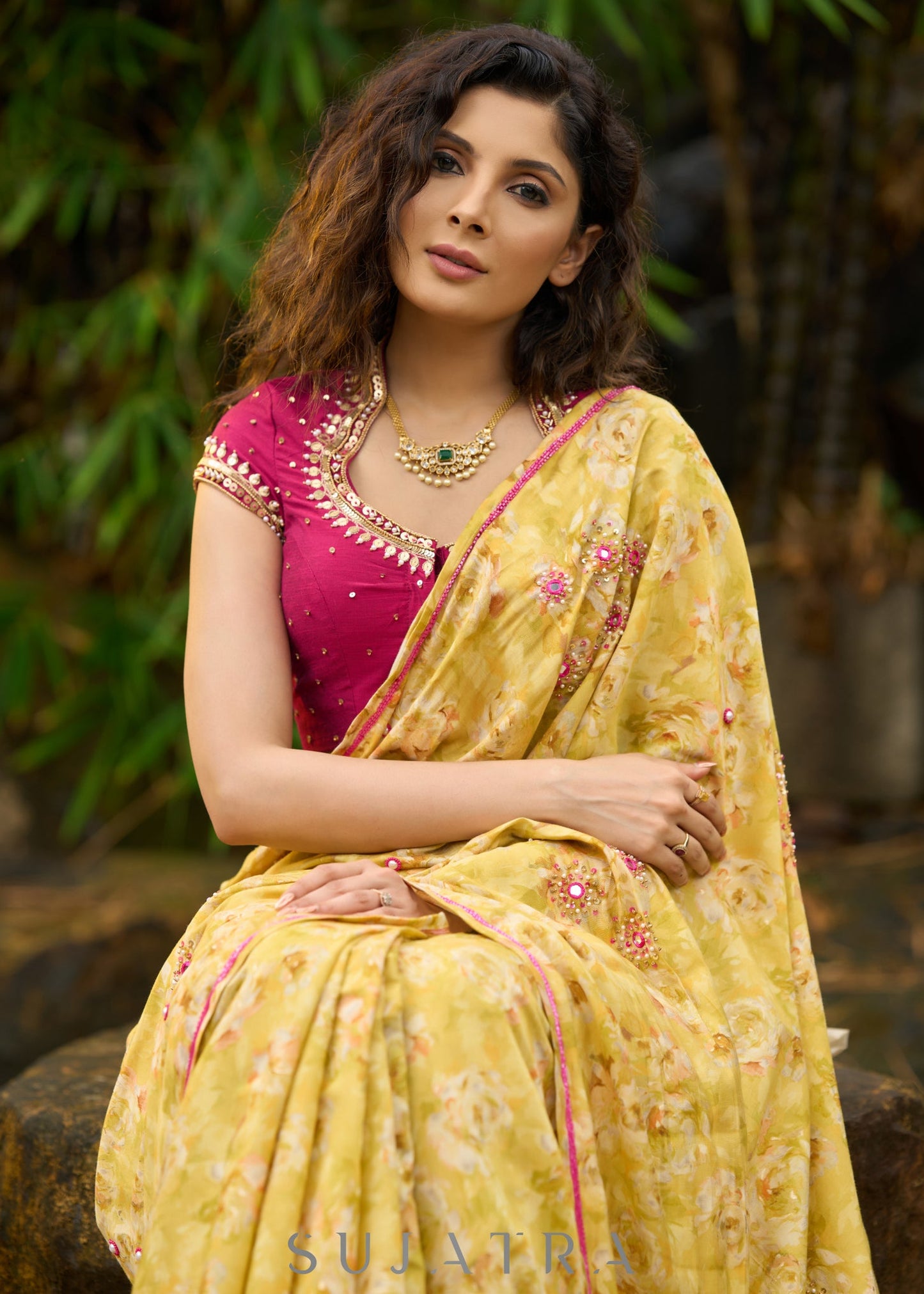 Graceful yellow floral print saree highlighted with overall beautiful hand embroidered mirrors