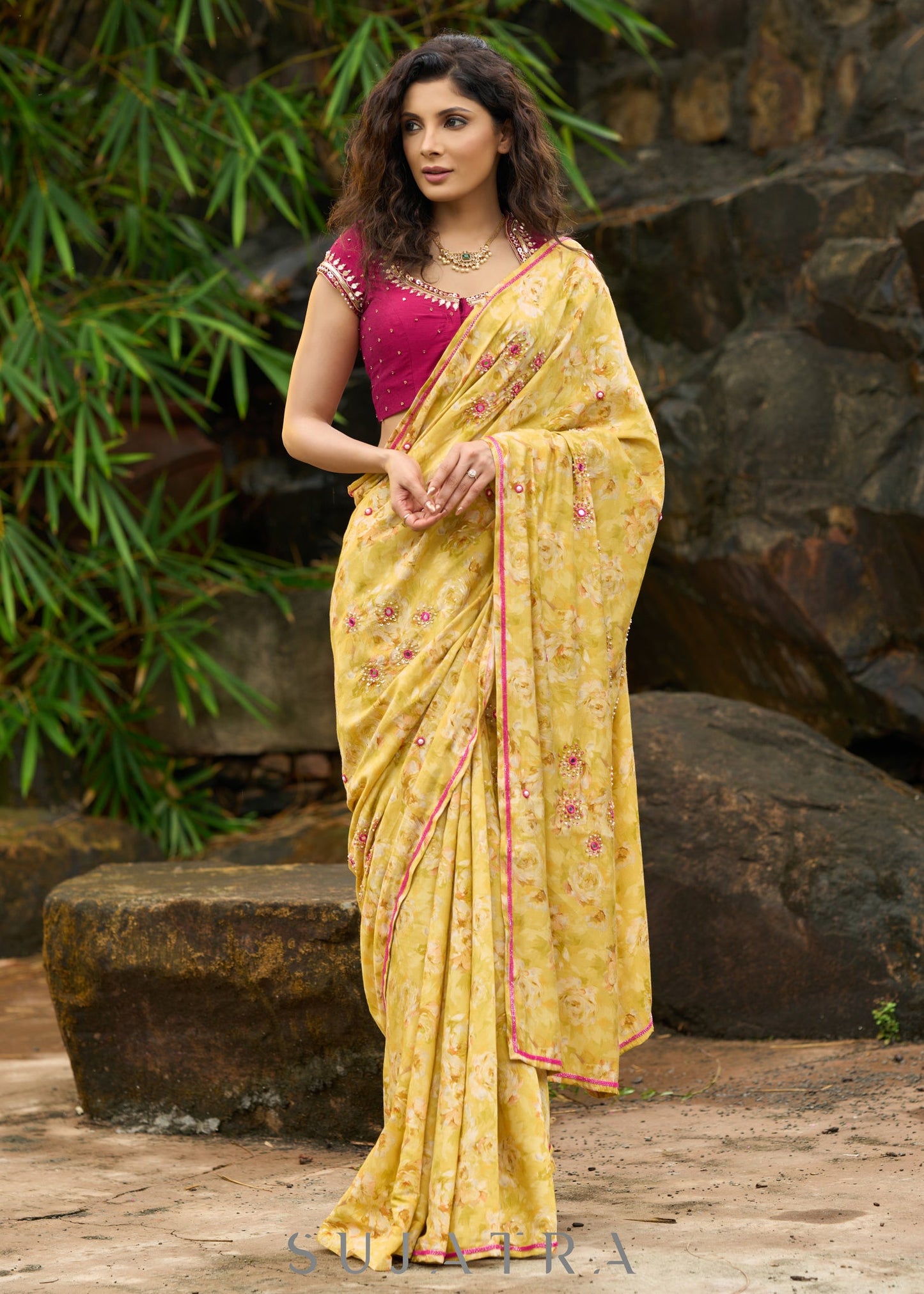 Graceful yellow floral print saree highlighted with overall beautiful hand embroidered mirrors