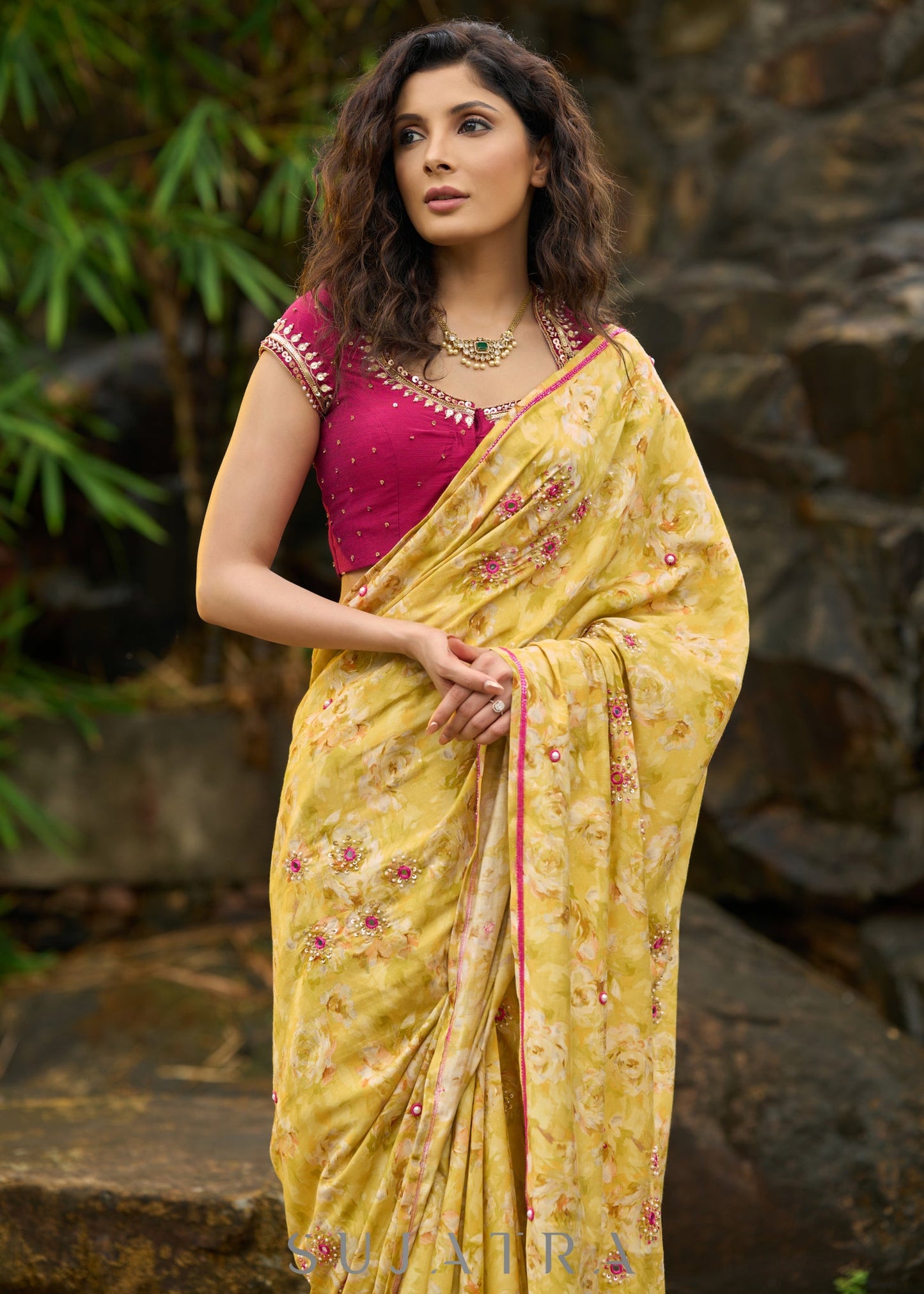 Graceful yellow floral print saree highlighted with overall beautiful hand embroidered mirrors