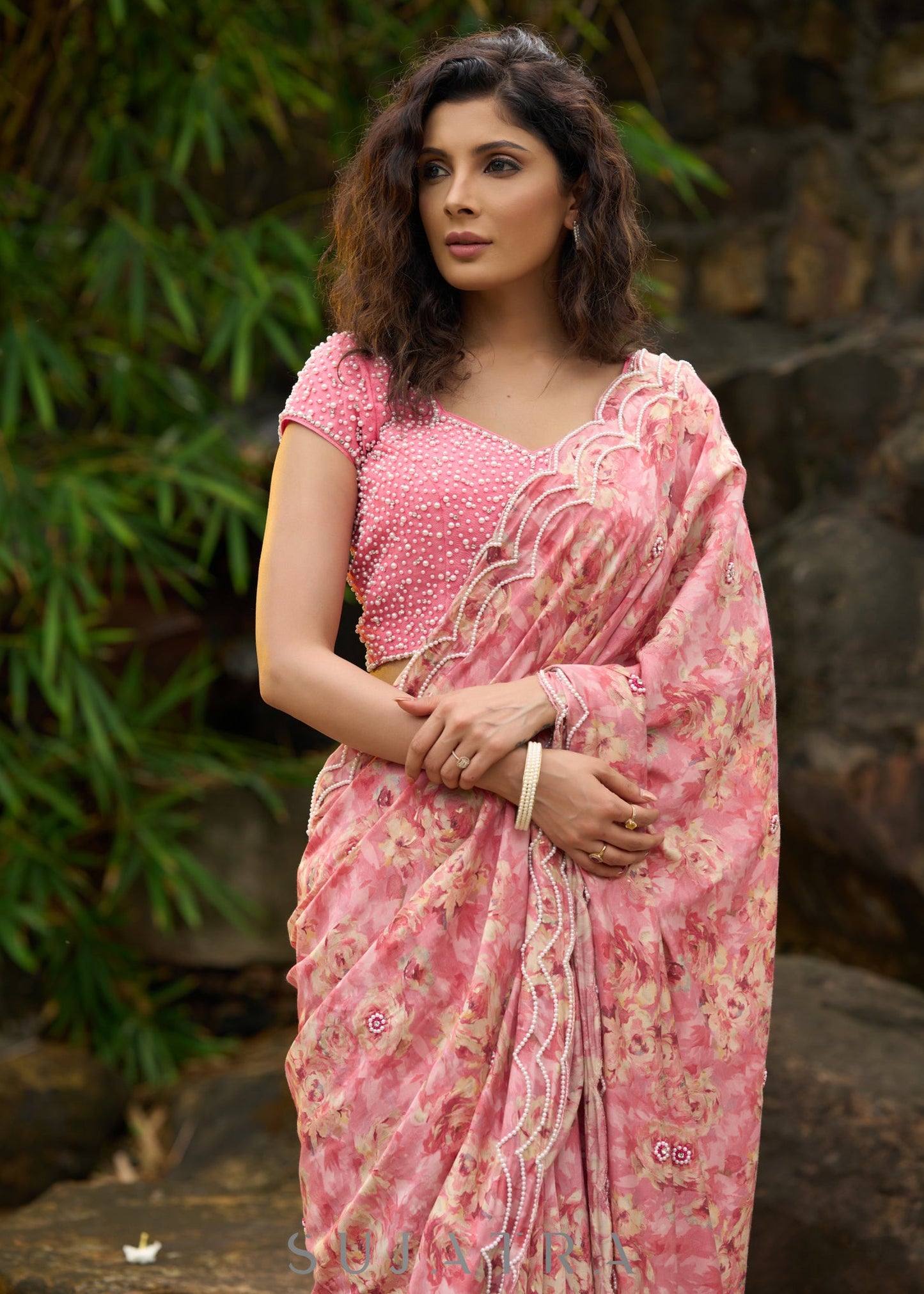 Beautiful blush pink floral saree highlighted with overall pearl embroidery