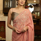 Luscious peach organza saree with beautiful floral hand embroidey and overall scallops