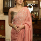 Luscious peach organza saree with beautiful floral hand embroidey and overall scallops