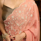 Luscious peach organza saree with beautiful floral hand embroidey and overall scallops