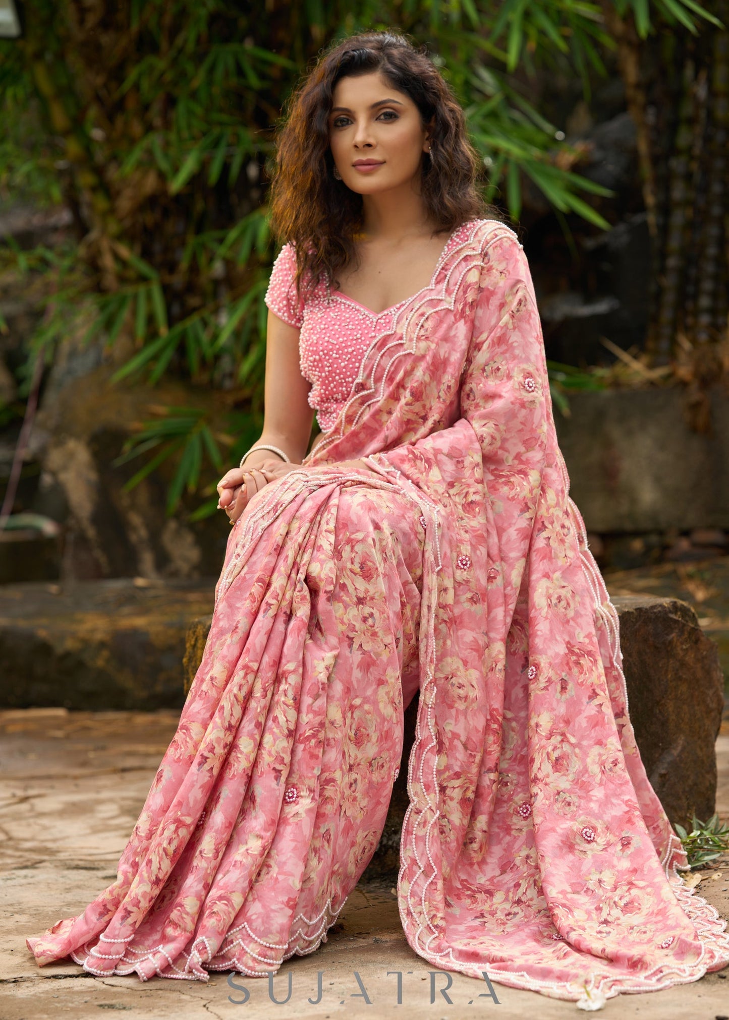 Beautiful blush pink floral saree highlighted with overall pearl embroidery