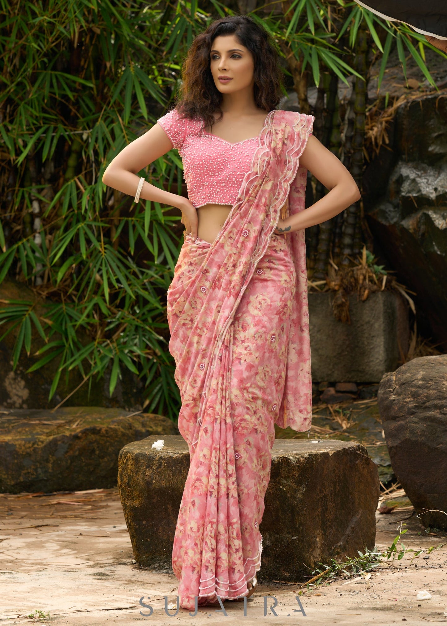 Beautiful blush pink floral saree highlighted with overall pearl embroidery