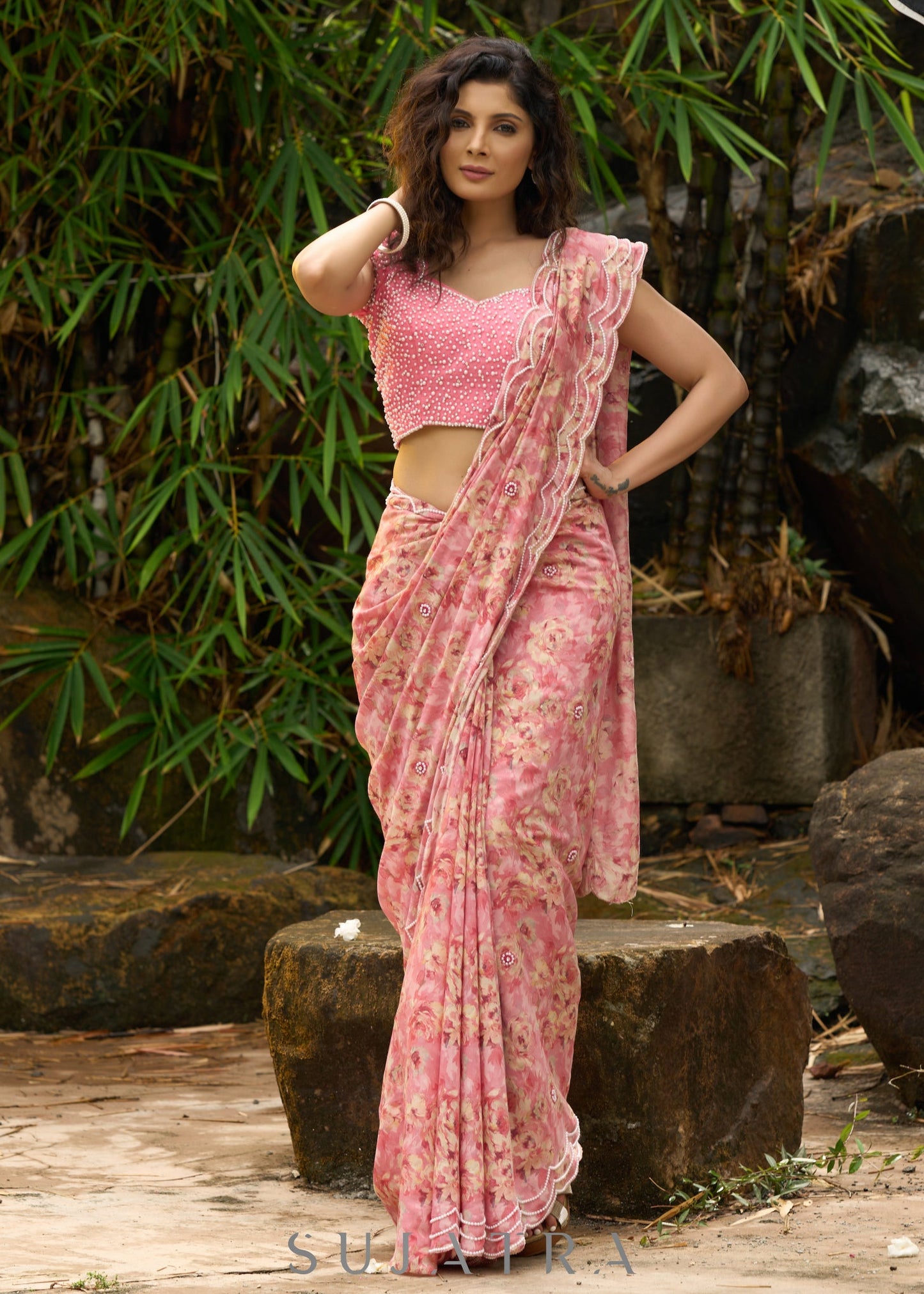 Beautiful blush pink floral saree highlighted with overall pearl embroidery