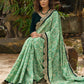 Elegant Emerald green floral printed saree highlighted with bottle green velvet & contrast scalloped lace