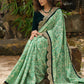 Elegant Emerald green floral printed saree highlighted with bottle green velvet & contrast scalloped lace