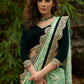 Elegant Emerald green floral printed saree highlighted with bottle green velvet & contrast scalloped lace