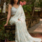 Stylish ice blue floral printed saree highlighted with beautiful golden embroidery