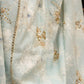 Stylish ice blue floral printed saree highlighted with beautiful golden embroidery