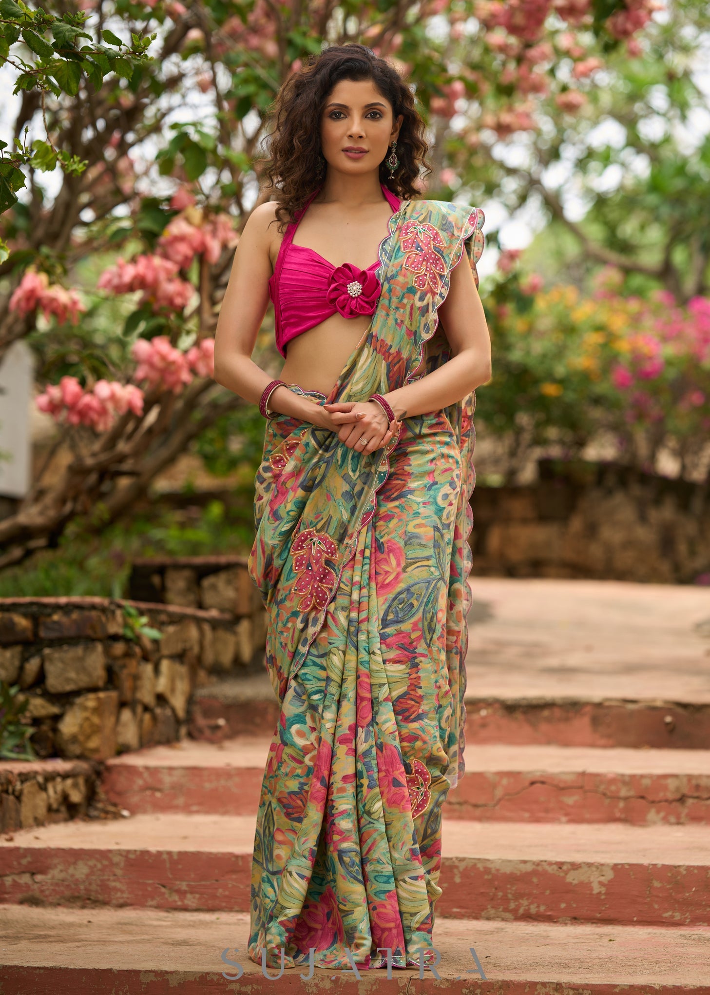 Exclusive multicolor floral print saree highlighted with overall pitta embroidery