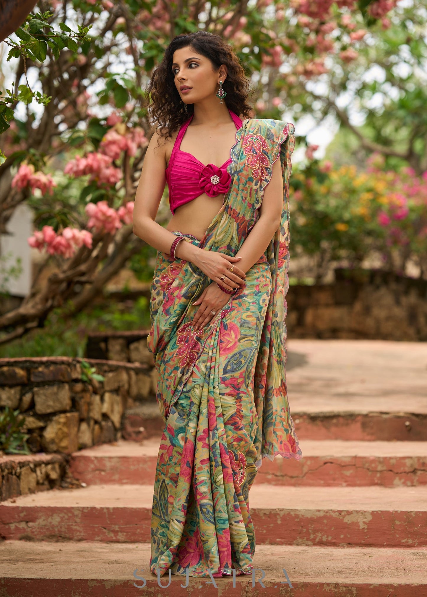 Exclusive multicolor floral print saree highlighted with overall pitta embroidery