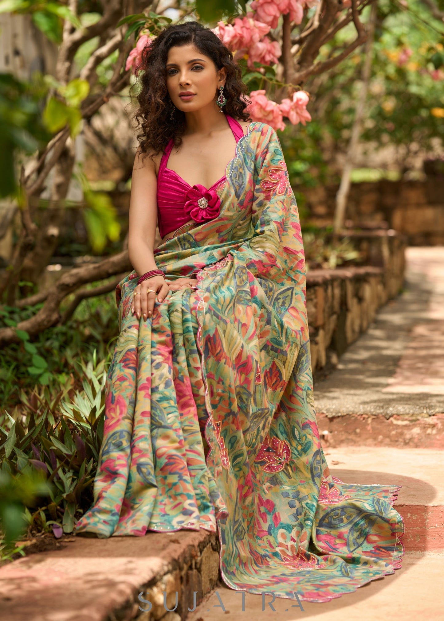 Exclusive multicolor floral print saree highlighted with overall pitta embroidery