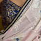 Subtle light pink floral embroidered saree highlighted with overall mirror embroidery and golden lace