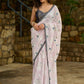 Subtle light pink floral embroidered saree highlighted with overall mirror embroidery and golden lace