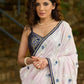 Subtle light pink floral embroidered saree highlighted with overall mirror embroidery and golden lace