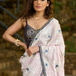 Subtle light pink floral embroidered saree highlighted with overall mirror embroidery and golden lace