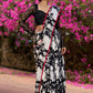 Trendy black floral printed cotton saree highlighted with overall bead embroidery