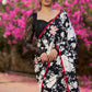 Trendy black floral printed cotton saree highlighted with overall bead embroidery