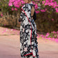 Trendy black floral printed cotton saree highlighted with overall bead embroidery