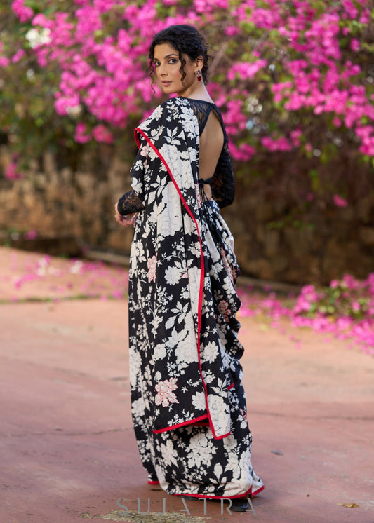 Trendy black floral printed cotton saree highlighted with overall bead embroidery