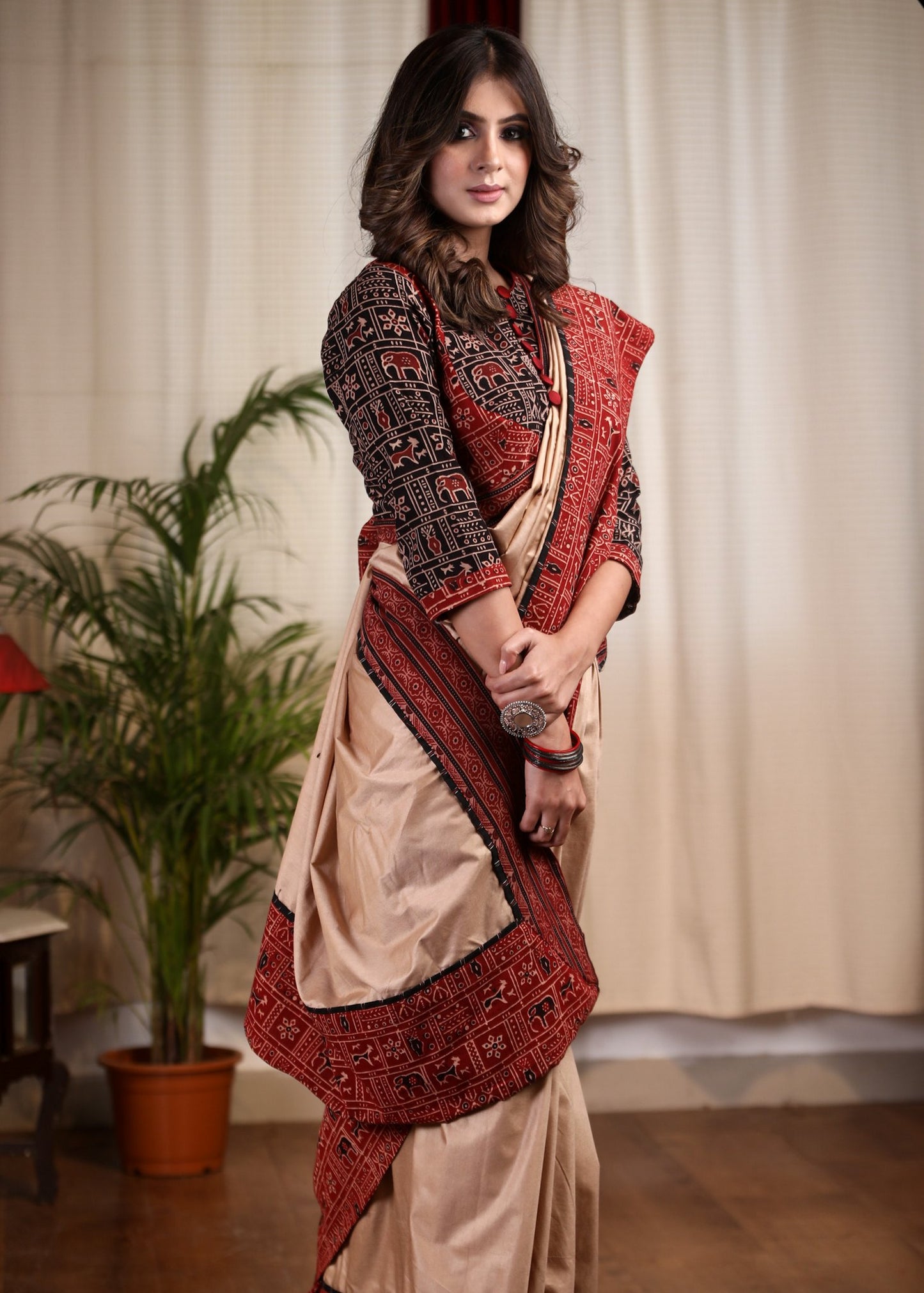 Beige silk cotton saree with block printed Ajrakh border