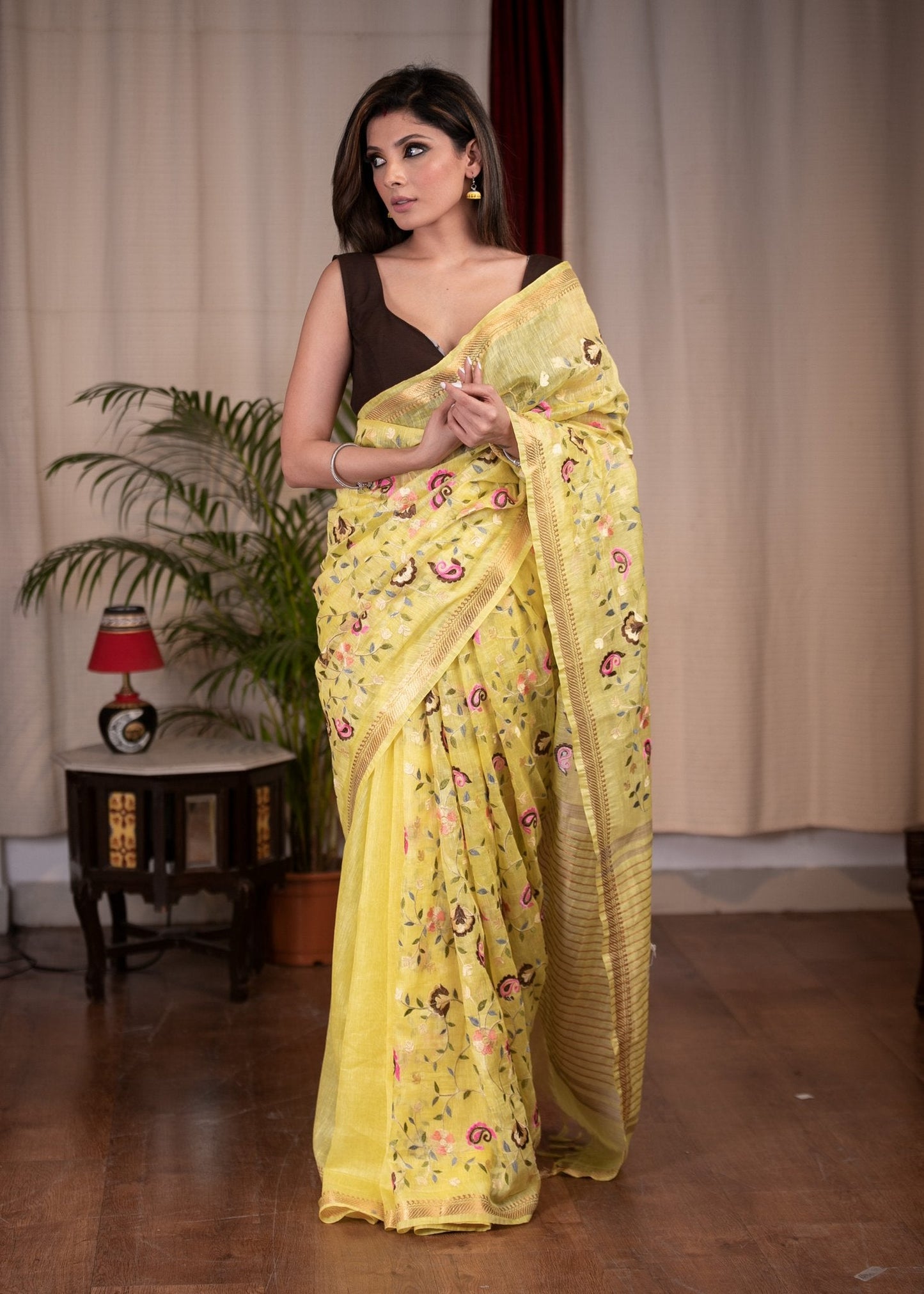 Exclusive embroidered yellow pure linen saree