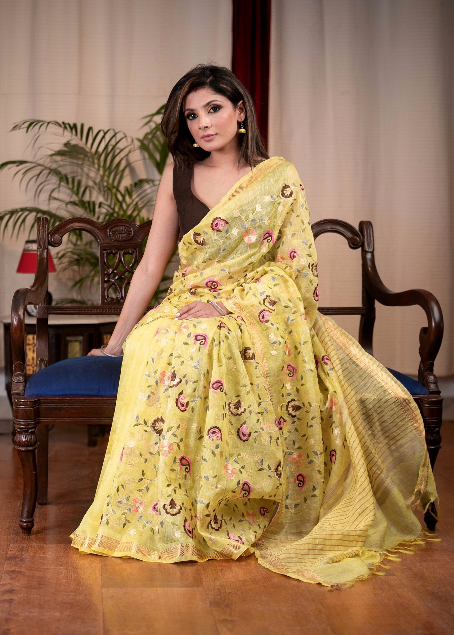 Exclusive embroidered yellow pure linen saree