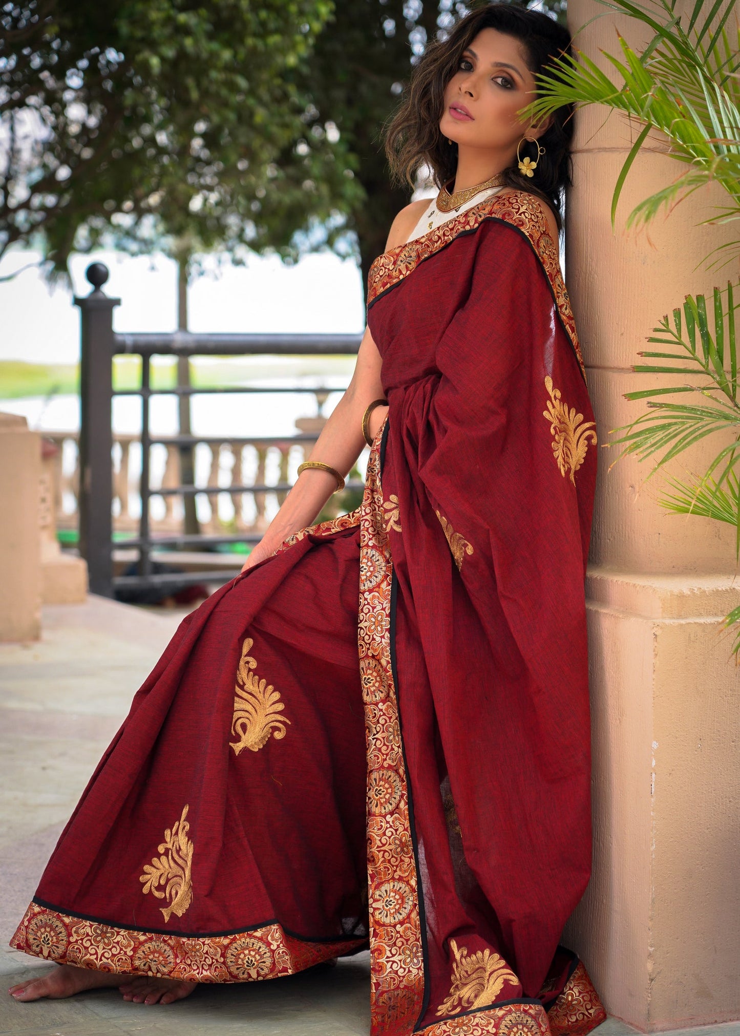 Maroon cotton saree with exclusive embroidered motifs and banarasi border