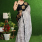 Gorgeous white striped saree with gold embroidered border on pallu