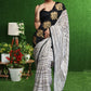 Gorgeous white striped saree with gold embroidered border on pallu