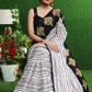 Gorgeous white striped saree with gold embroidered border on pallu