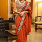 Exquisite rust Cotton plain saree with line Ajrakh border