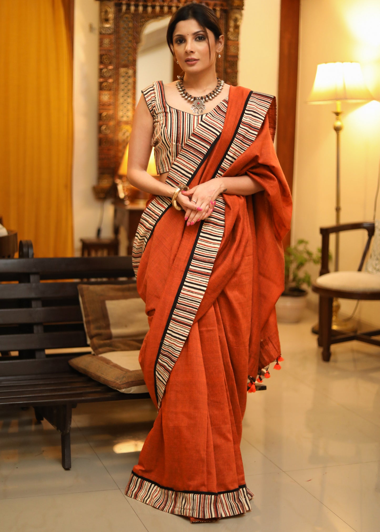 Exquisite rust Cotton plain saree with line Ajrakh border