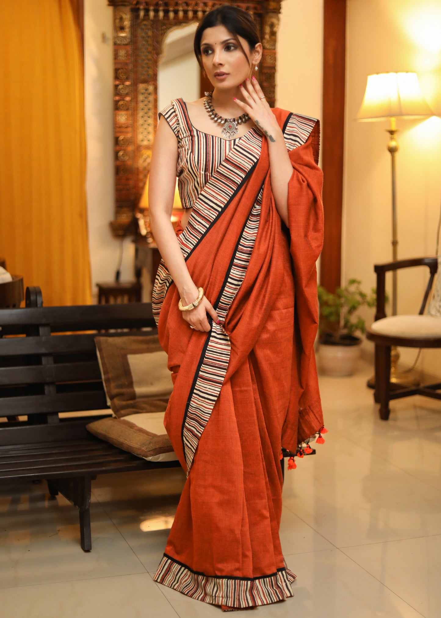 Exquisite rust Cotton plain saree with line Ajrakh border