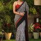 Spring bloom blue printed saree with Ajrakh and Cotton silk combination border with red stone Embellishment